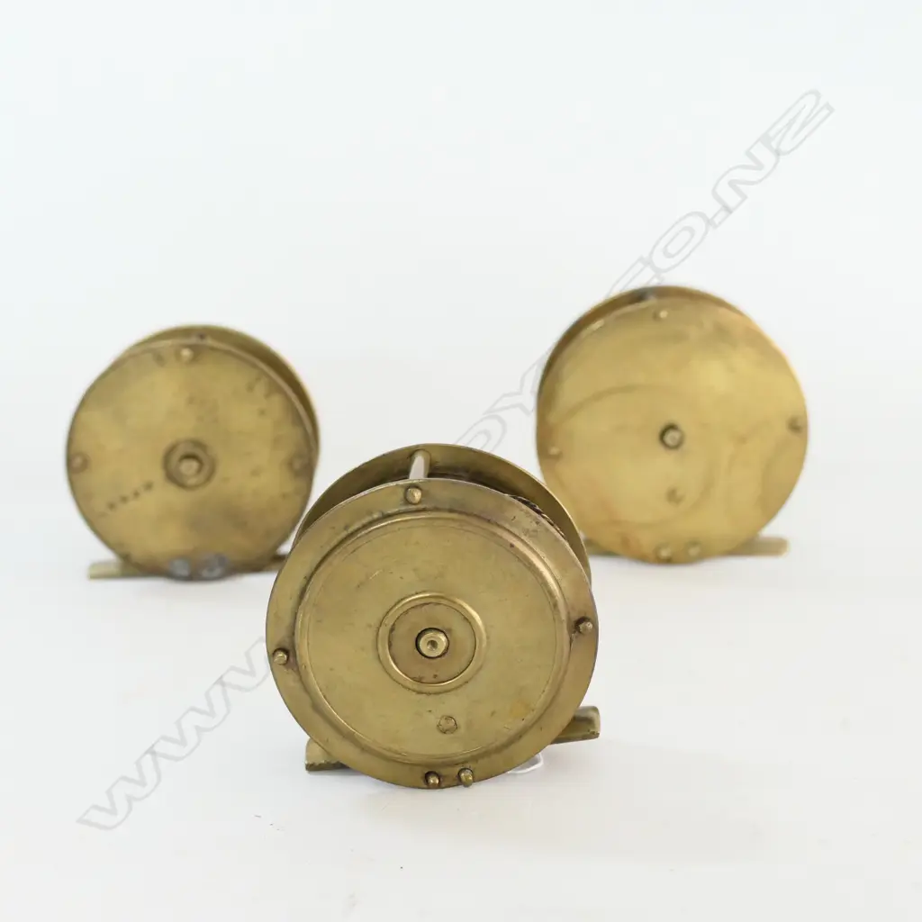3 SMALL BRASS FISHING REELS,(ONE w PERMENENT CHECK) Image 1++